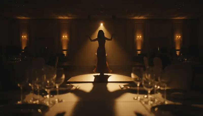 Belly dancer in silhouette on stage at a corporate gala dinner