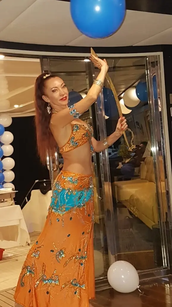 Belly dancer M dancing at a party on a yacht