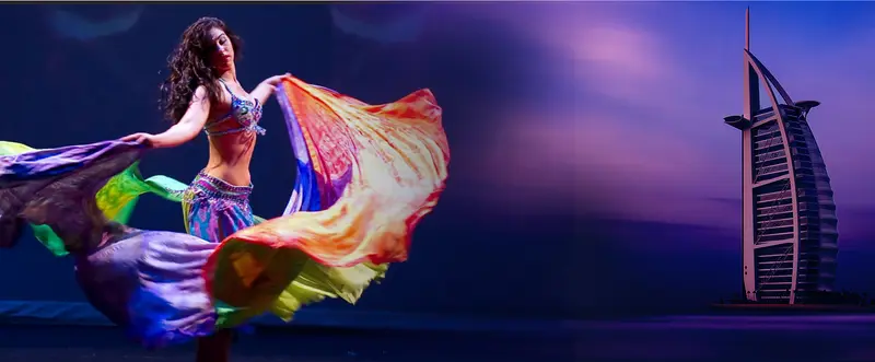Darina, belly dancer, with rainbow veils and the Burj Al Arab behind her