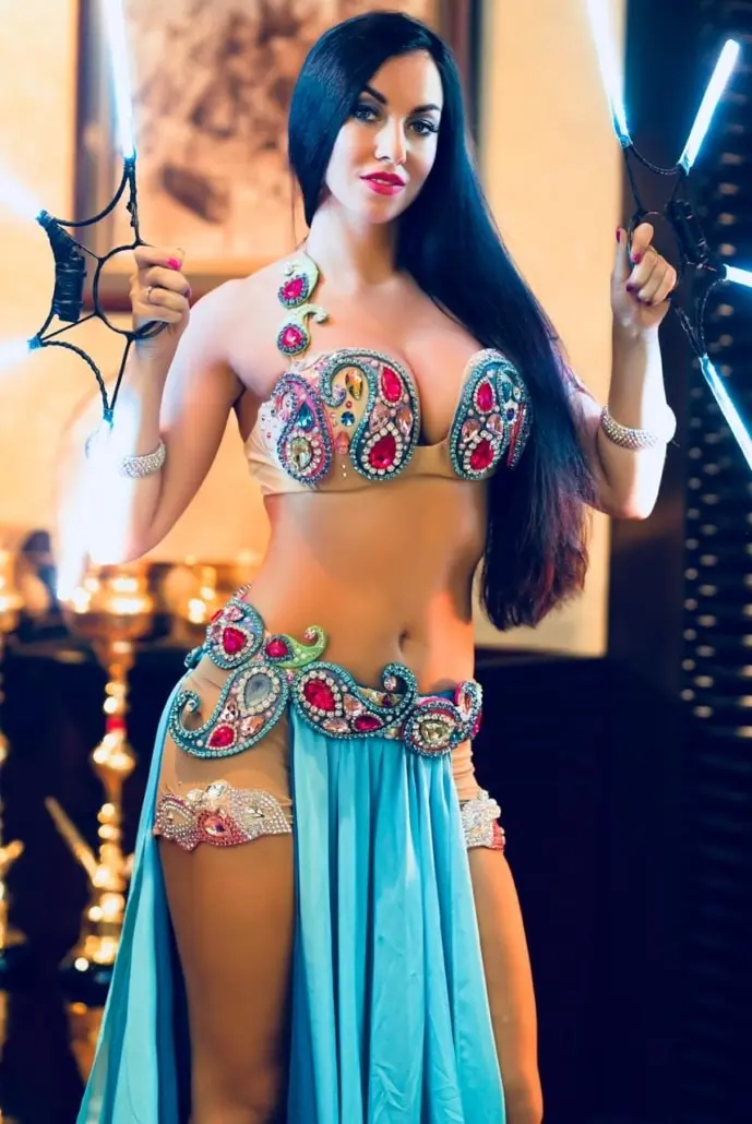 Maria, belly dancer, in a turquoise jewelled costume