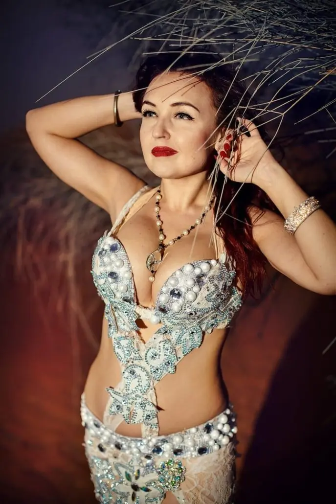 Omira, belly dancer, in a white jewelled costume
