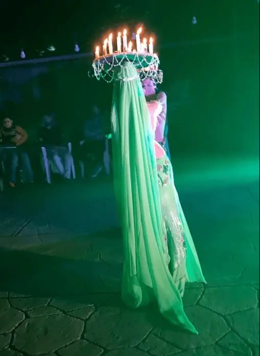 Zulia, belly dancer, performing with a candle crown on her head